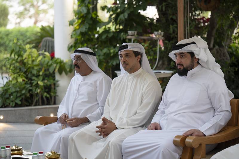 Sheikh Mansour bin Zayed, UAE Deputy Prime Minister and Minister of Presidential Affairs, centre, sits with Sheikh Ahmed bin Mohammed bin Rashid, right, and Mohamed Juma Al Naboodah. Mohamed Al Hammadi / Ministry of Presidential Affairs 