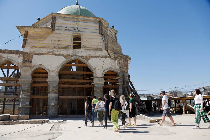 Tourists visit the 12th century Al Nuri Mosque in Mosul. Restoration is scheduled to be completed by next year. Reuters