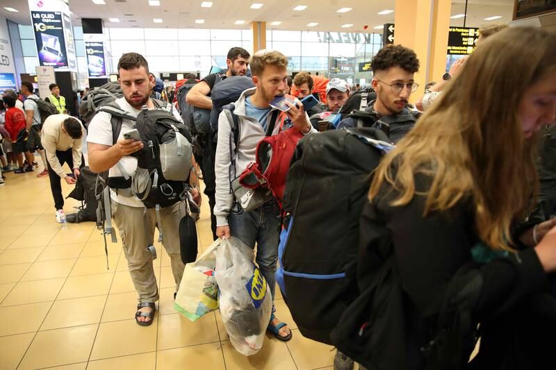 Young Israelis queue to board a flight to Tel Aviv at the Jorge Chavez International Airport in Lima, Peru, on Tuesday.  EPA