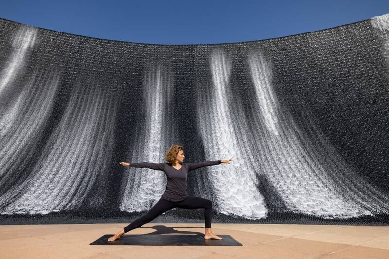 The yoga session takes place within the Water Feature's structure at Expo 2020 Dubai. Photo: Walaa Alshaer / Expo 2020 Dubai