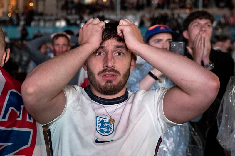 England supporters react in Trafalgar Square to England's loss to Italy in the Uefa Euro 2020 Final.