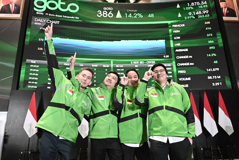 (From left) GoTo Group president Patrick Cao, co-founder William Tanuwijaya, group chief executive Andre Soelistyo and co-founder Kevin Aluwi after the company's IPO on the stock exchange in Jakarta. AFP