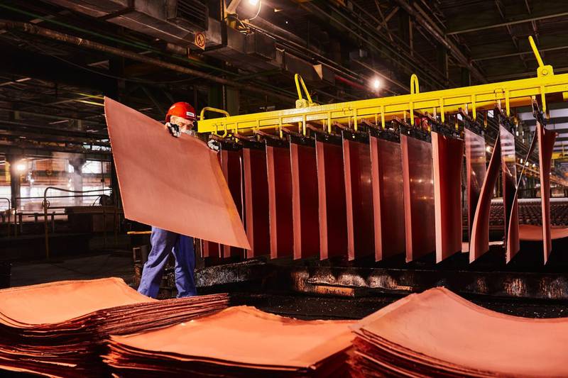 A worker handles newly formed copper cathode sheets in a warehouse at the KGHM Polska Miedz SA copper smelting plant in Glogow, Poland, on Tuesday, March 9, 2021. Nickel extended its plunge from a six-year high after a stock-market slump hurt risk appetite, while copper resumed losses as supply concerns eased. Photographer: Bartek Sadowski/Bloomberg