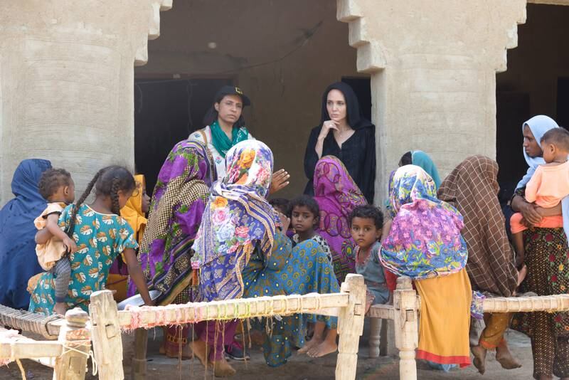 Women in the village of Ibrahim Chandio in Dadu, Sindh talk to Angelina Jolie about some of the horrors they continue to face following the floods. Photo: International Rescue Committee