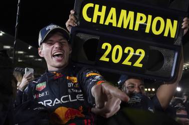 Red Bull driver Max Verstappen of the Netherlands celebrates with teammates as he became F1 drivers world champion, during the Japanese Formula One Grand Prix at the Suzuka Circuit in Suzuka, central Japan, Sunday, Oct.  9, 2022.  (AP Photo / Toru Hanai)