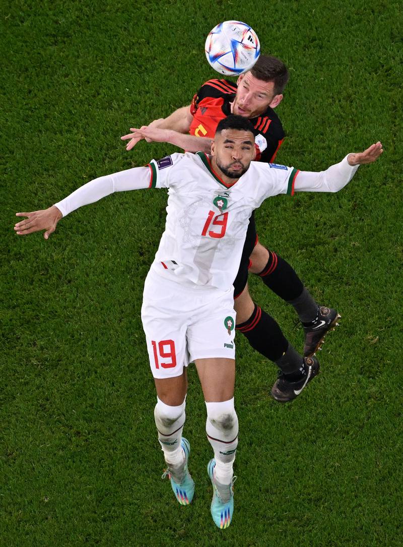 Morocco's  Youssef En-Nesyri and Belgium defender Jan Vertonghen fight for the ball. AFP