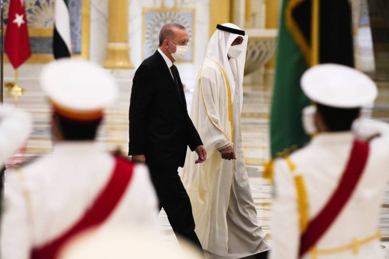 President Erdogan and Abu Dhabi Crown Prince Sheikh Mohamed bin Zayed inspect over an honour guard at Qasr Al Watan. AP Photo / Jon Gambrell