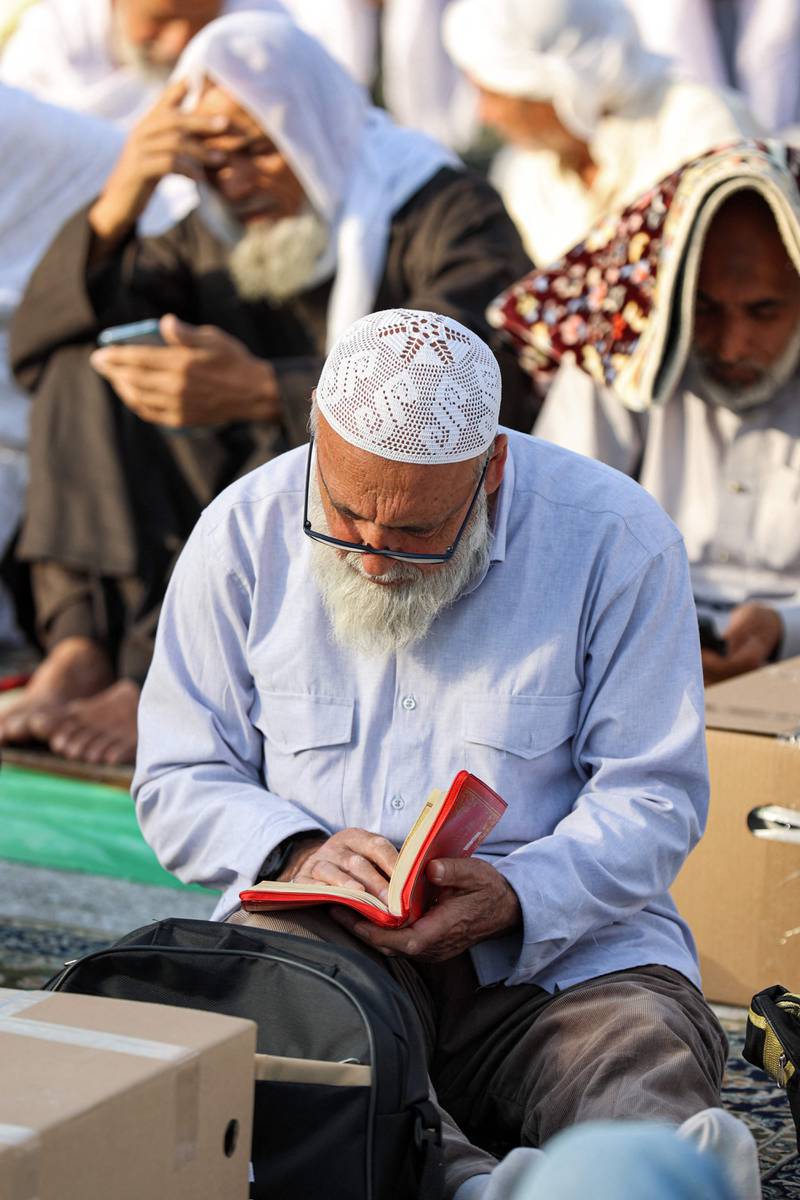A man reads the Quran at the Grand Mosque in Makkah