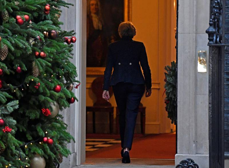 Theresa May walks back into 10 Downing Street. Reuters