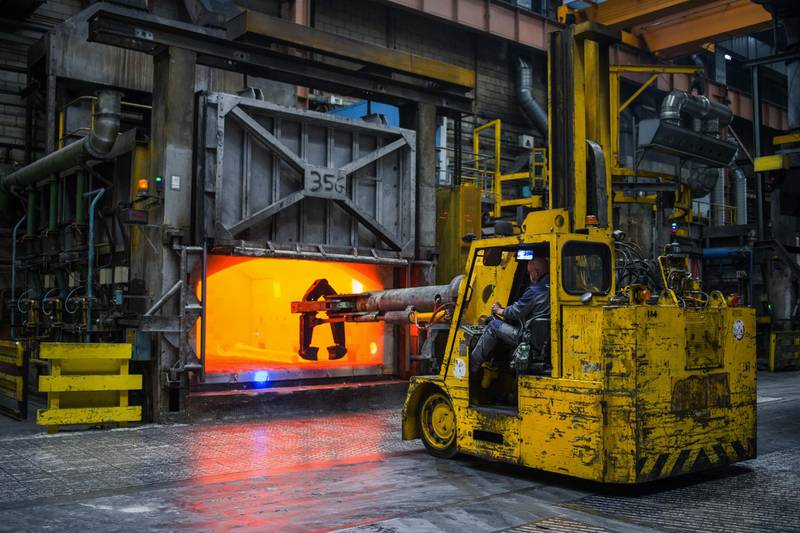 A worker in a forklift prepares to collect a metal turbine shaft for a LEAP 1-B engine for Boeing Co. 787 passenger aircraft from a furnace at the Safran SA aircraft engine plant in Gennevilliers, France. Bloomberg