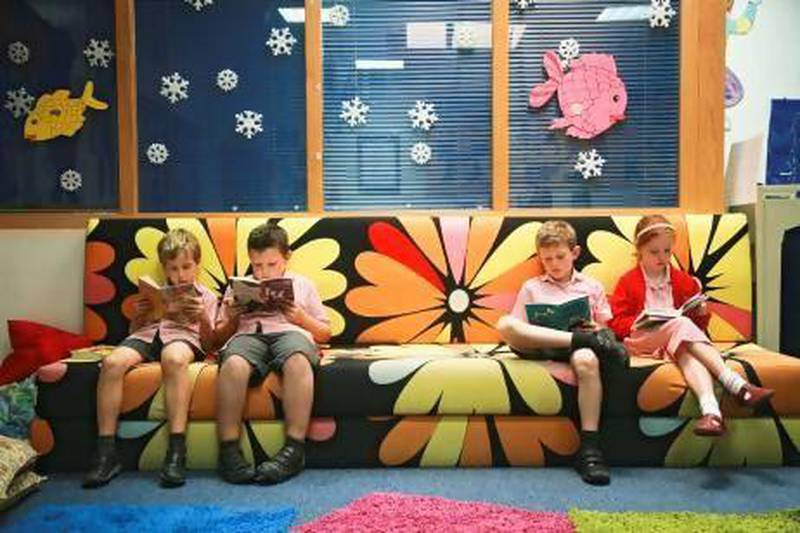 Dubai English Speaking School celebrates its 50th anniversary this week. Students enjoy a quiet read in the school library. Lee Hoagland / The National