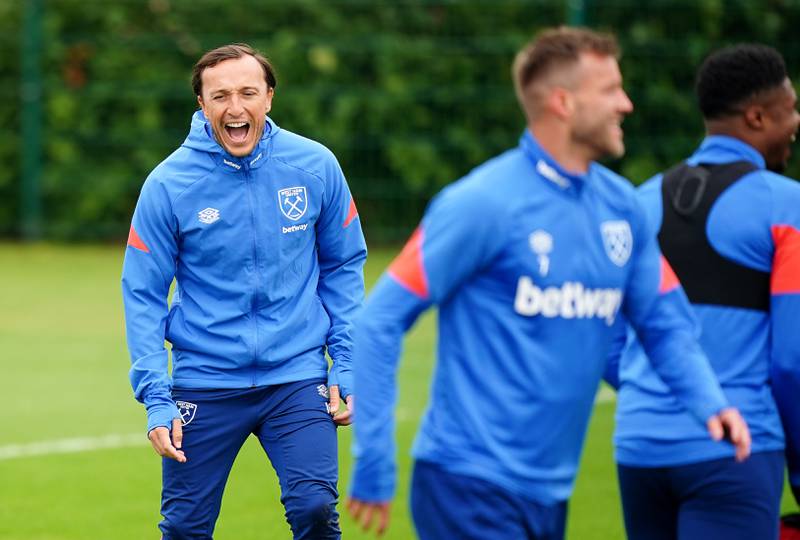 West Ham's Mark Noble has a laugh during training. PA