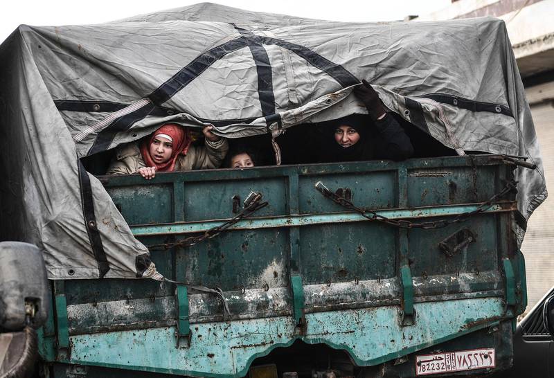 Civilians flee from Idlib toward the north to find safety inside Syria near the border with Turkey. AP Photo