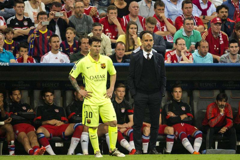 Barcelona’s Lionel Messi stands next to Bayern Munich manager Pep Guardiola, his former coach at Barca, during the second leg of the Champions League semi-final. Odd Andersen / AFP