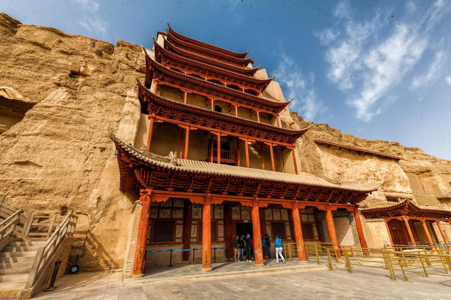 epa07060832 A general view of the Mogao Caves in Dunhuang, Gansu Province, China, 26 September 2018, (issued 01 October 2018). Dunhuang is a city in northwestern Gansu Province, Western China. City was major stop on the ancient Silk Road, established in an oasis which contains Crescent Lake and had strategic position on a crossroads of the Southern Route of Silk Road and main road from India trough Tibet and Mongolia to Southern Siberia. Donhuang is tourist destination best known for Crescent Lake, Mogao Caves, Yardang Geopark and desert with countless sand dunes which are merging to stone composed desert and mountains. At winter temperature riches -25 C and sand dunes become frozen with tops covered in snow. Mogao Caves are located 25 km form Dunhuang. Buddhist caves are famous for their Buddhist art such as murals inside, Buddhist statues and Dunhuang manuscripts found hidden in a sealed-up cave. There is 735 of them. Crescent Lake is a crescent-shaped lake in an oasis, 6 km south of the city. Lake is top tourist attraction and landmark in Donhuang where dune sledding, camel or SUV ride, helicopter flight or dune hiking are offered to visitors. Reports say Dunhuang city of about 200 000 population, accommodate 10 million visitors during a year. Yardang Geopark also known as Devilâ€™s Town and part of it as Ghost Town, is located 180 kilometers northwest of Dunhuang. The park contains rock formations of unique shape developed over a period of 700,000 years. When there are no wind visitors experience soundless environment while walking between rock formations of witch some are naturally shaped to remind viewer on peacock, buddha, camel etc. Yardang covers area of abut 400 square kilometers and its part of UNESCO protected areas.  EPA/ALEKSANDER PLAVEVSKI