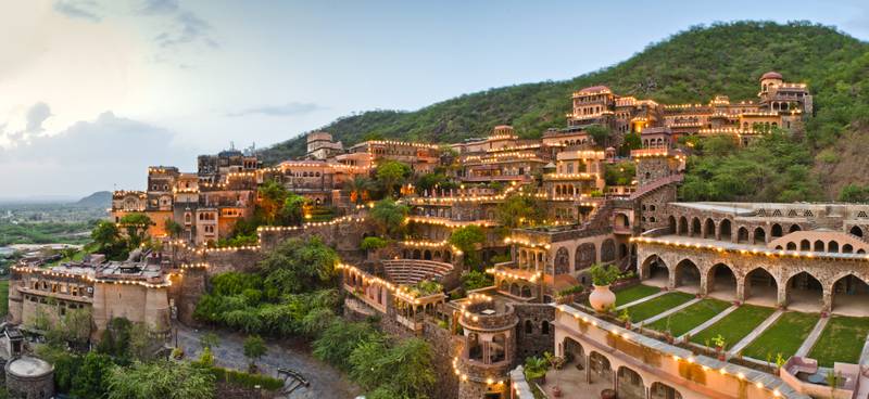 Neemrana Fort Palace is located on a hill commanding panoramic views of the Indian countryside. The 55-roomed hotel features 12 separate levels and palatial wings fronted by well-manicured gardens. Photo: Neemrana Fort Palace