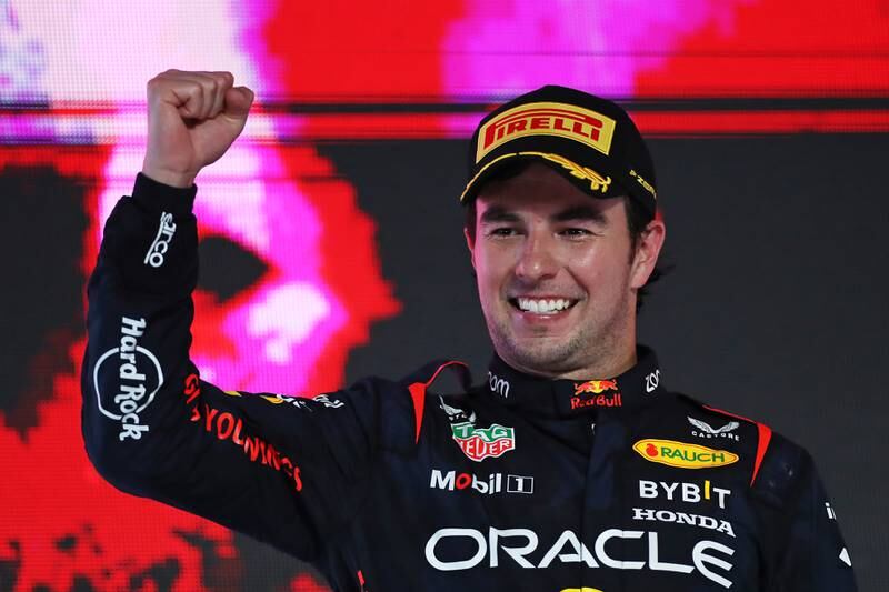 Red Bull's Sergio Perez celebrates on the podium after winning the Saudi Arabia Grand Prix at Jeddah Corniche Circuit on March 19, 2023. Getty