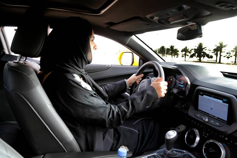 epa06734238 A woman tests a car during a car show only for women in Riyadh, Saudi Arabia, 13 May 2018. Women are expected to be allowed to drive cars in Saudi-Arabia starting in mid June 2018.  EPA/STR