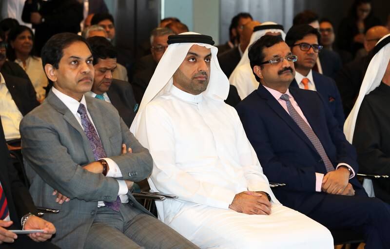 From left, Sunjay Sudhir, Indian ambassador to the UAE, Mohammad Ali Rashed Lootah, president of Dubai Chambers of Commerce and Industry and Rajiv Podar, chairman of Podar Enterprise, at the India-UAE Partnership Summit in Dubai in January 2023. Pawan Singh / The National 
