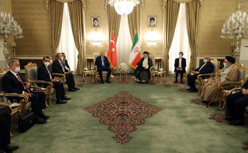 Mr Erdogan and Mr Raisi, with officials from their countries, meet in Tehran. Reuters