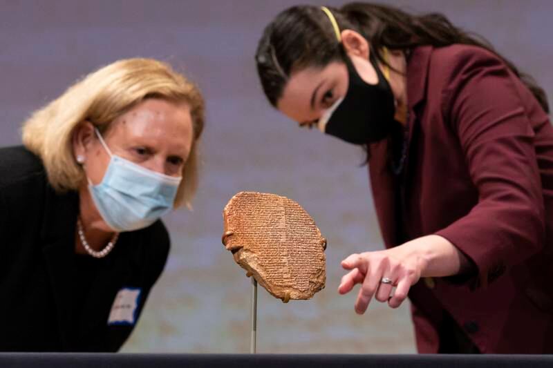 Cultural heritage preservation scholar Katharyn Hanson, right, and DePaul University professor Patty Gerstenblith with the Gilgamesh tablet at the Smithsonian Institution National Museum of the American Indian in Washington, DC. EPA