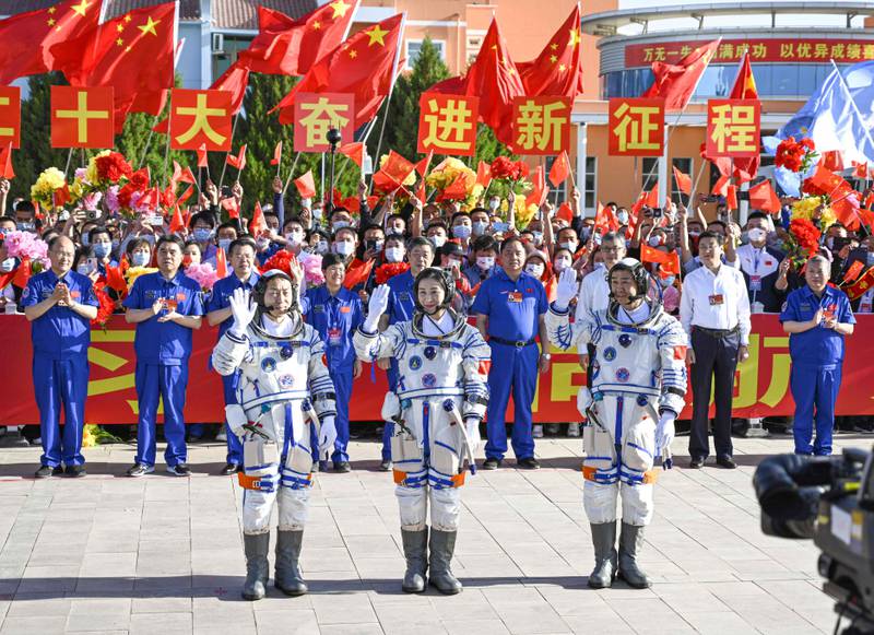 Chinese astronauts Cai Xuzhe (L), Chen Dong (C) and Liu Yang pose during a ceremony prior to the launch at the Shenzhou-14 mission at the Jiuquan Satellite Launch Center in Northwest China’s Gansu Province on June 5, 2022. China  launched a rocket carrying three astronauts on a mission to complete construction on its new space station, the latest milestone in Beijing's drive to become a major space power.  Photo by AFP /  China OUT