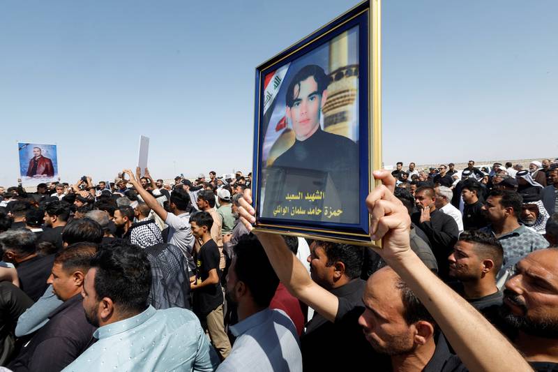 People at the funeral of Shiite inmates killed by ISIS when the terrorists overran Badoush prison in Nineveh in 2014. Reuters