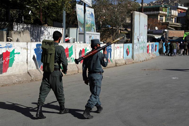 Afghan security personnel patrol with a rocket propelled grenade launcher at the site of an attack at Kabul University in Kabul. AP Photo
