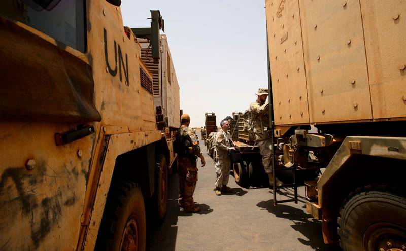 The first Canadian troops load into United Nations troop carriers as they arrive at a United Nations base in Gao, Mali, on Sunday, June 24, 2018. (Sean Kilpatrick/The Canadian Press via AP)