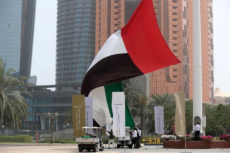 Abu Dhabi, United Arab Emirates - March 01, 2019: The UAE flag is replaced by a new one as the wind blows strong in Abu Dhabi. Friday the 1st of March 2019 at Emirates Palace, Abu Dhabi. Chris Whiteoak / The National