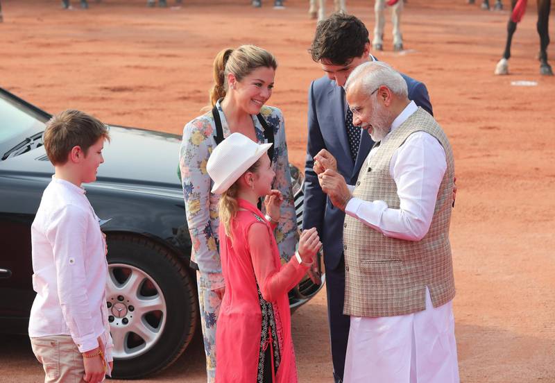 Mr Trudeau's daughter, Ella-Grace, is welcomed by Mr Modi. Harish Tyagi / EPA