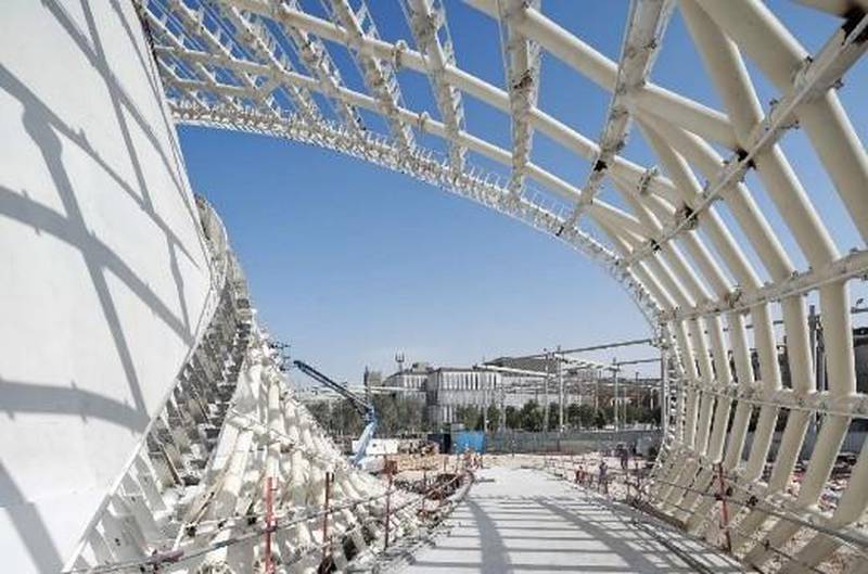 Workers fix a membrane to provide shade and cover to the steel construction of the Luxembourg pavilion. Visitors can walk down the stairs or chose to zip down a giant slide, a reference to the popular Schueberfouer, a traditional fair that dates back to 1340. Courtesy: Luxembourg pavilion at Expo 2020
