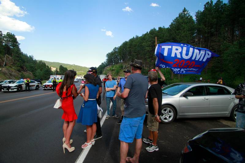 Trump supporters, some who were blocked from reaching Mount Rushmore by a blockade set up by Native American protesters, gather near where protesters clashed with law enforcement officers in Keystone, South Dakota. AP Photo