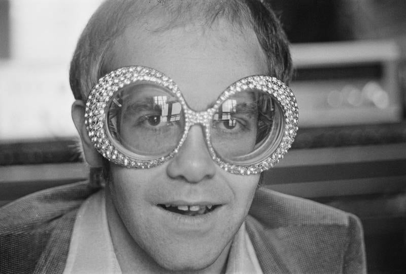 The singer-songwriter wearing a pair of his flamboyant trademark spectacles in 1974. Getty Images