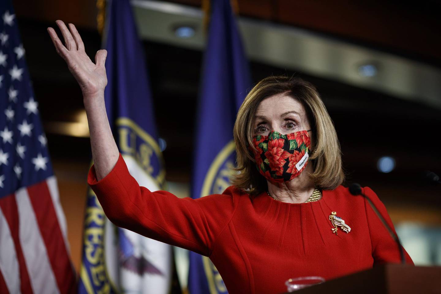 U.S. House Speaker Nancy Pelosi, a Democrat from California, wears a protective mask while speaking during a news conference at the U.S. Capitol Building in Washington, D.C., U.S., on Sunday, Dec. 20, 2020. Congressional leaders reached a deal on a roughly $900 billion spending package to bolster the U.S. economy amid the continued coronavirus pandemic giving lawmakers a short timetable to review and pass the second largest economic-rescue measure in the nation's history. Photographer: Ting Shen/Bloomberg