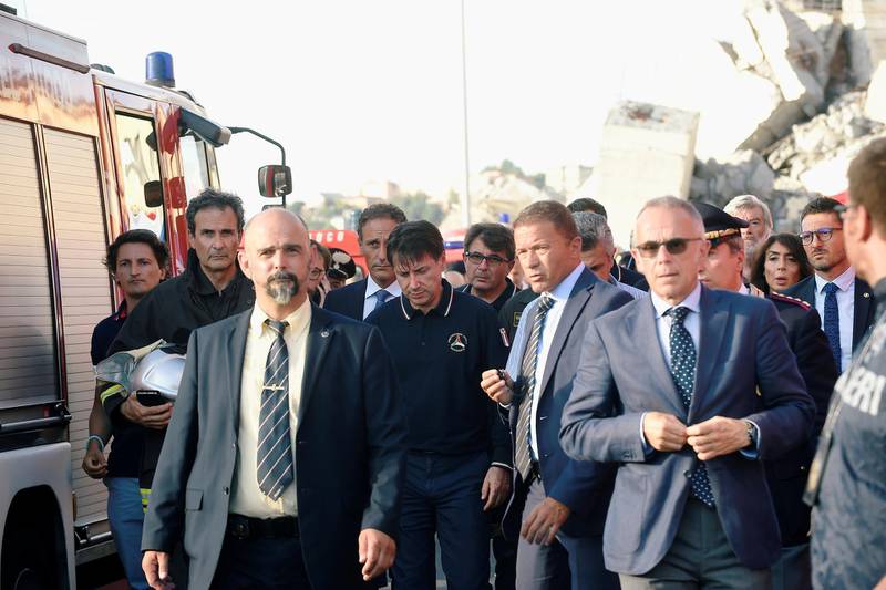 Italian Prime Minister Giuseppe Conte arrives to inspect the site of the collapsed Morandi Bridge. Reuters