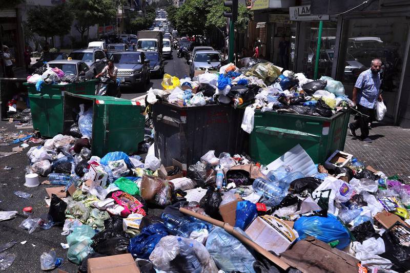 A road in Beirut is blocked off  to vehicles with rubbish and bins. Ramco, the waste collection company for Beirut, said it resumed operations on July 15, 2020 after the municipality agreed to settle unpaid dues. AP Photo