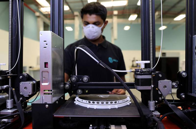 DUBAI, UNITED ARAB EMIRATES , April 07 – 2020 :-  Karteek Raghu , Operations Manager looking 3D printers which are making the structure of 3D Face Shields at the Immensa Technology Labs in Dubai Production City in Dubai. (Pawan Singh/The National) For News/Online/Instagram. Story by Nick Webster 