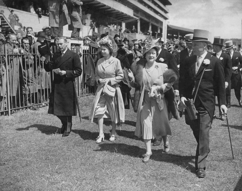 Left to right: King George VI (1895 - 1952), Princess Elizabeth (later Queen Elizabeth II), Queen Elizabeth (later Queen Mother, 1900 - 2002) and Bernard Fitzalan-Howard, 16th Duke of Norfolk (1908 - 1945) at the Oaks Stakes, Epsom Downs Racecourse, Surrey, 3rd June 1948. (Photo by Fox Photos/Hulton Archive/Getty Images)