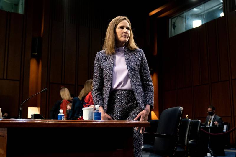 FILE - In this Wednesday, Oct. 14, 2020 file photo, Supreme Court nominee Amy Coney Barrett departs during a break in a confirmation hearing before the Senate Judiciary Committee on Capitol Hill in Washington. On Friday, Oct. 16, 2020, The Associated Press reported on stories circulating online incorrectly asserting that when reporters asked President Donald Trump why he nominated Barrett to replace the late Supreme Court Justice Ruth Bader Ginsburg, he said Barrett is â€œmuch better lookingâ€ than other women who have appeared on the court and â€œif people are more attractive, they get a fantastic amount of respect.â€ There is no evidence Trump made these comments. (Stefani Reynolds/Pool via AP)