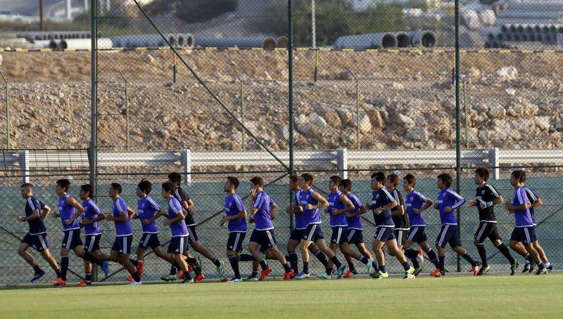 Japan football players jog during a training session on Tuesday in Muscat ahead of their 2018 AFC World Cup qualifying match against Syria on Thursday night. Mohammed Mahjoub / AFP