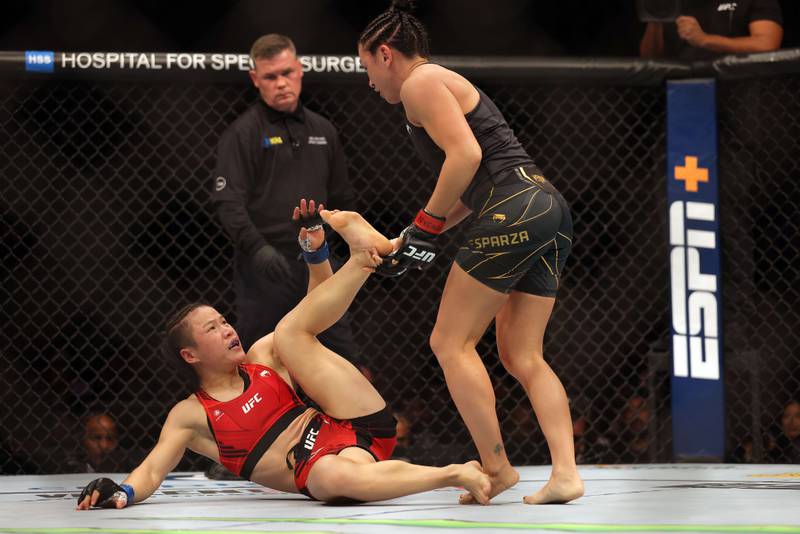 Weili Zhang battles Carla Esparza during their Women Strawweight fight at UFC 281. Getty