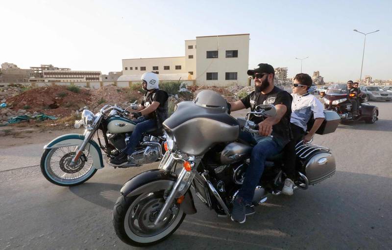 Members of Libyan motorcycle clubs take to the road in Benghazi. AFP