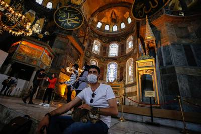 People visit the Byzantine-era Hagia Sophia, one of Istanbul's main tourist attractions. Turkey’s top administrative court announced its decision to revoke the 1,500-year-old former cathedral’s status as a museum. AP Photo