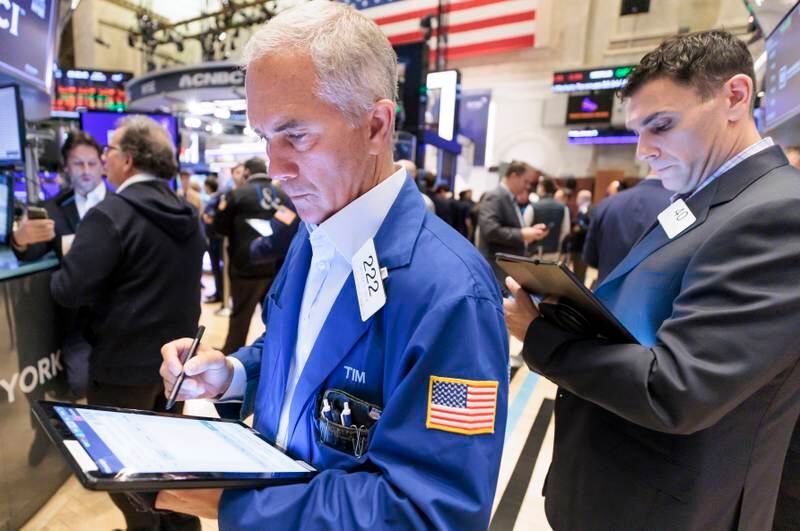 Traders work at the New York Stock Exchange. US stocks have rebounded to start the year after a rough 2022, but have lagged their international counterparts. EPA