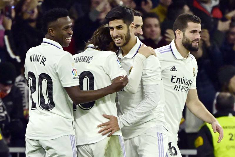 Real Madrid players celebrate their first goal scored by Marco Asensio. AFP