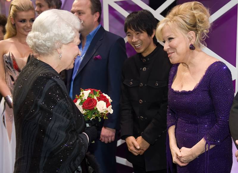 Queen Elizabeth and American singer and actress Bette Midler chat after the Royal Variety Performance in 2009. Getty Images