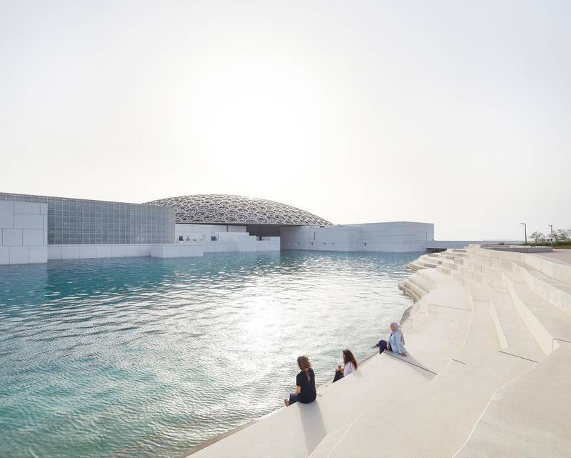 People sit by the Louvre in Abu Dhabi. DCT Abu Dhabi