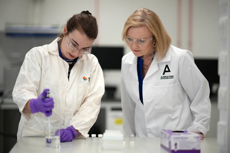 Liz Truss speaks to scientists during a campaign visit to a life sciences laboratory at Alderley Park in Manchester. PA