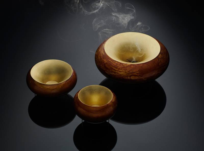 These hand-made vessels designed by Adi Toch are made using traditional silversmithing techniques. The wide opening of the incense burners help disperse the scent of burning Oud. Courtesy Irthi